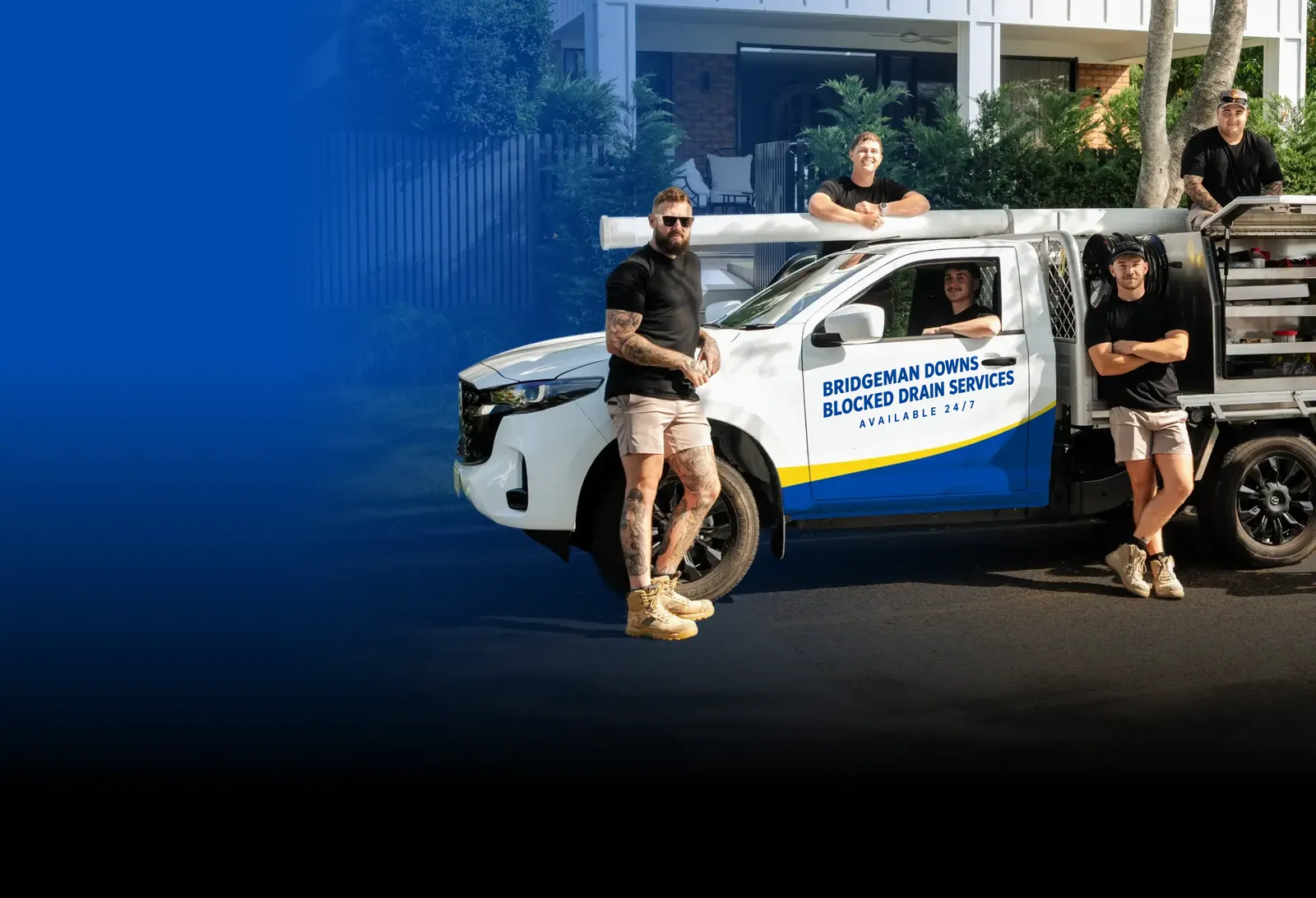 Bridgeman Downs Blocked Drain Services team with the ute